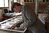 Mark Stephens repairing East Church, Cromarty windows